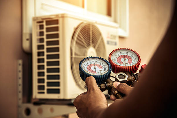 Professional Air Conditioning Service technician working in Salem, NY